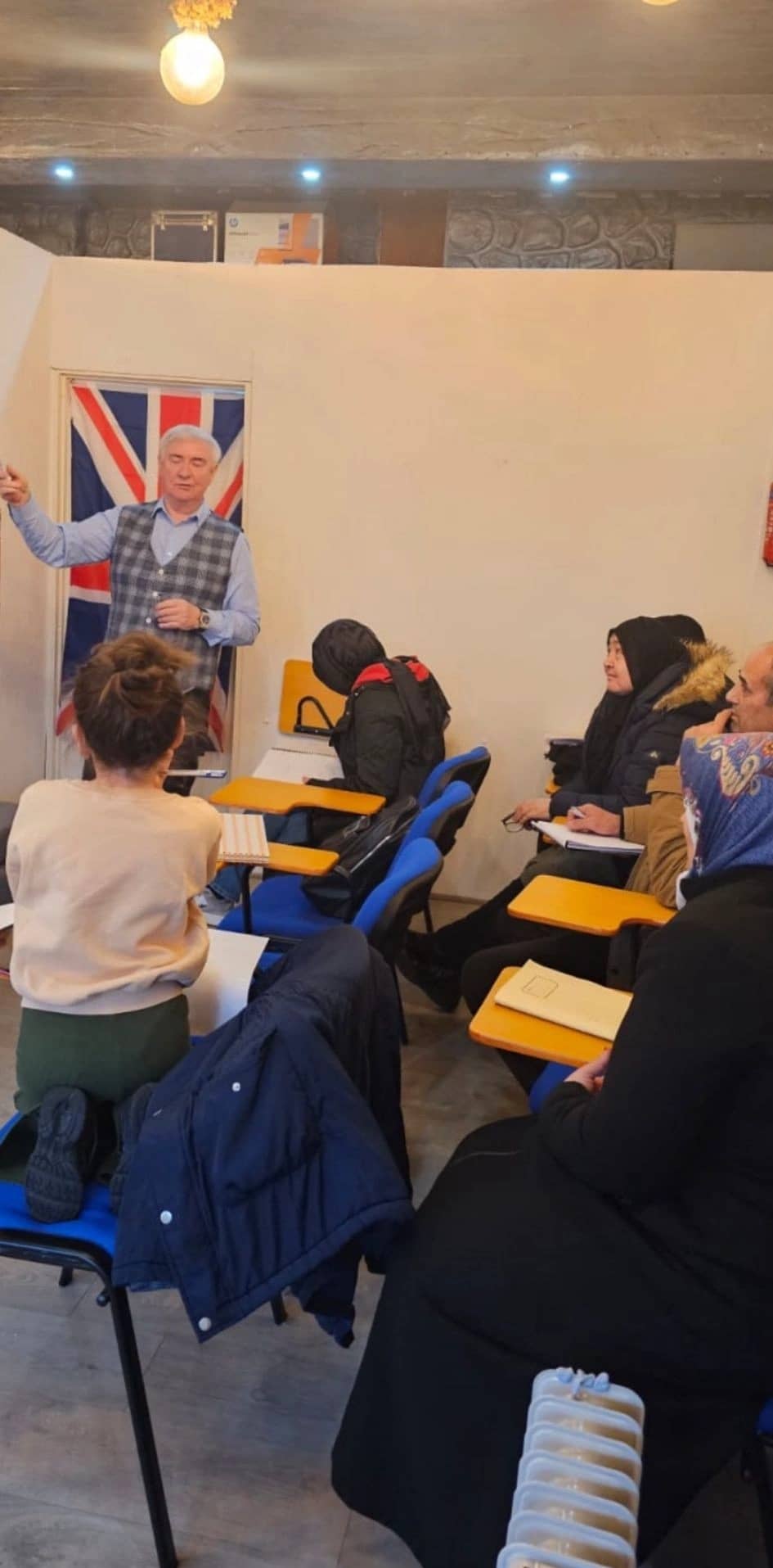 Steve Hoca explaining lessons to students